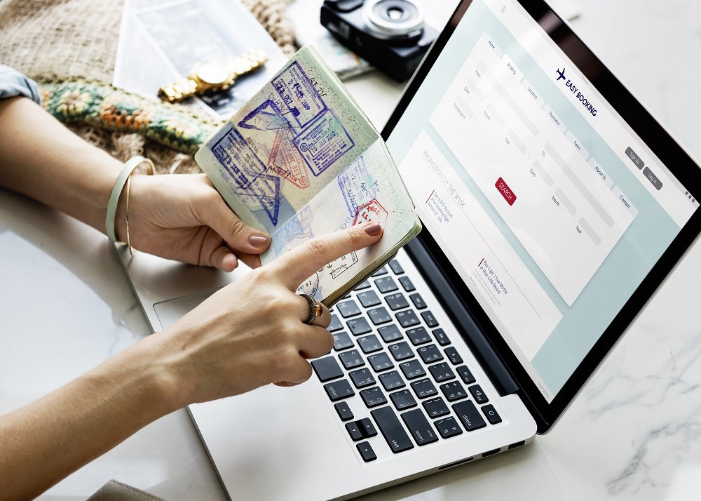 Pointing Passport Stamp Online Flight Booking Concept Pointing Passport Stamp Online Flight Booking Concept
